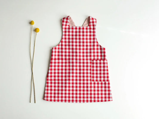 Red and white checkered dress on a light gray background