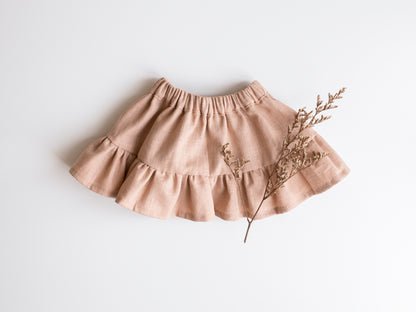 Kids circle skirt sewing pattern with elastic waistband for ages 0-6. Includes step-by-step instructions and fabric cutting guide.