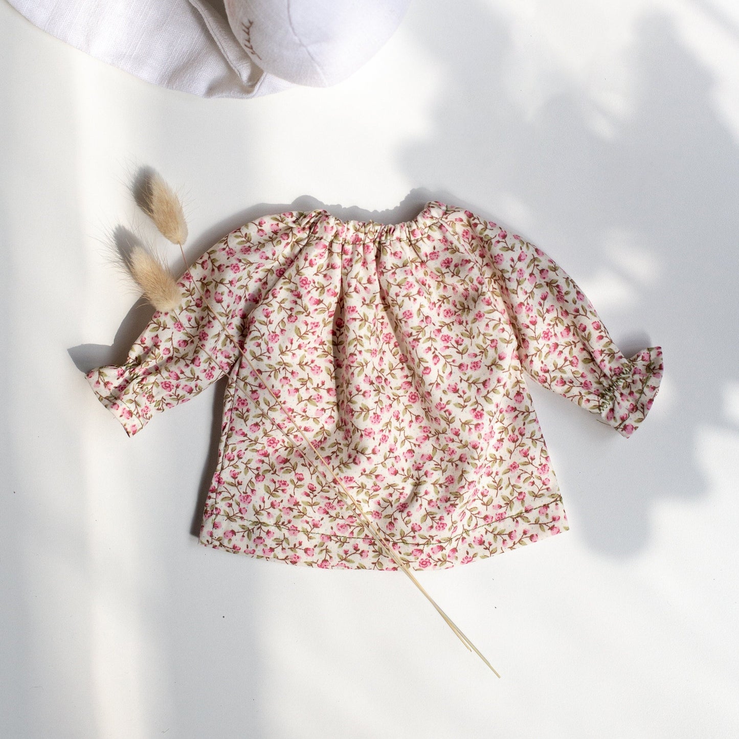 Floral baby dress on a white background