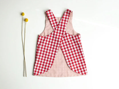 Red and white checkered apron on a light background