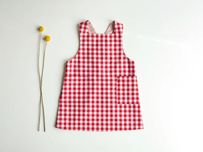 Red and white checkered dress on a light gray background