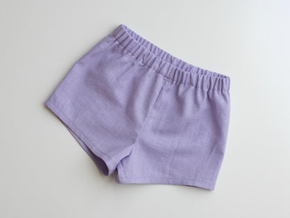 Purple shorts on a light gray background